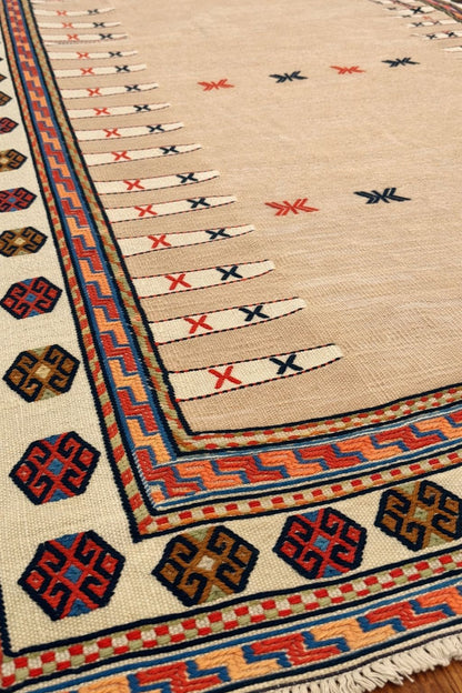 Tapis iranien rose pâle